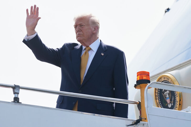 President Donald Trump waves as he boards Air Force One at Kuala Lumpur International Airport in Sepang, Malaysia, as he departs for Japan, Monday, Oct. 27, 2025. (AP Photo/Mark Schiefelbein)