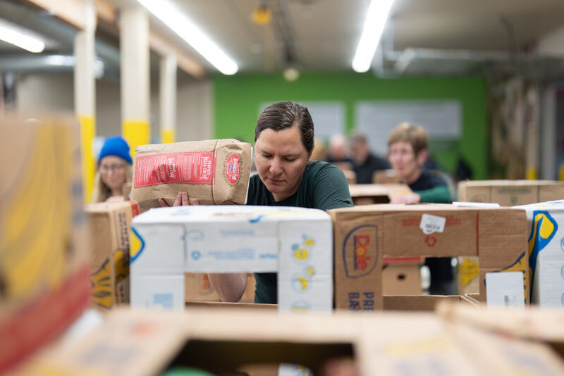 A volunteer sorts items for distribution at the Oregon Food Bank in Portland, Ore., Wednesday, Oct. 29, 2025. (AP Photo/Jenny Kane)