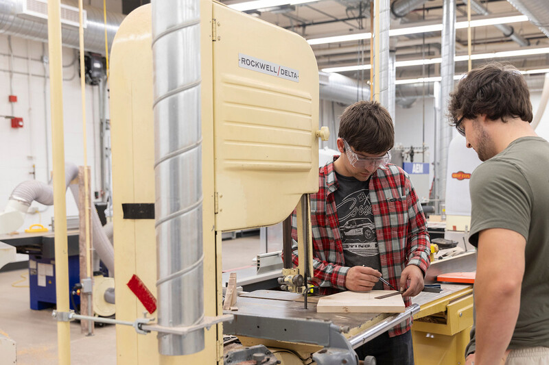 UW-Stout students work with a bandsaw in the newly renovated Woods Lab inside the Jarvis Hall Technology Wing.