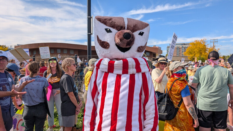 A Bucky Badger who marched in the No Kings protest in Madison said he didn’t mind missing the football game for such and important event. | Photo by Baylor Spears/Wisconsin Examiner