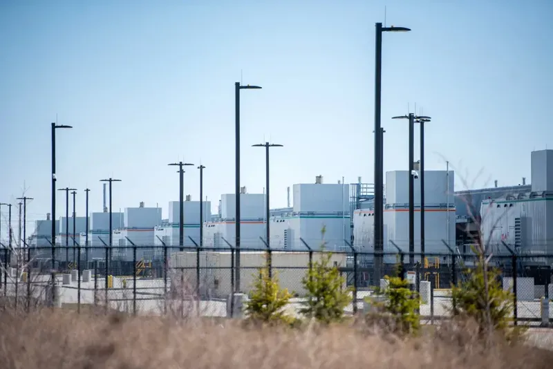 A Microsoft data center is situated near a hiking trail Tuesday, April 8, 2025, in West Des Moines, Iowa. Angela Major/WPR