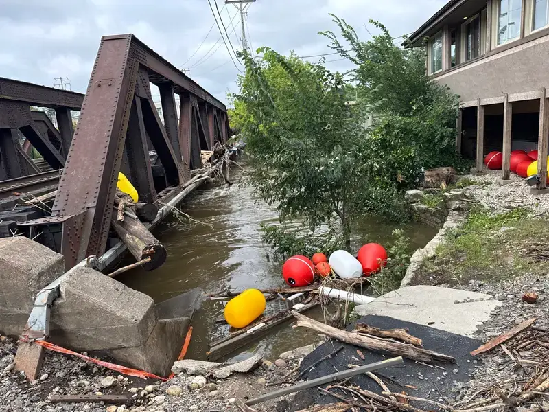 The aftermath of heavy rainfall near the Menomonee River in the village area in Wauwatosa is seen here on Monday, Aug. 11, 2025. Evan Casey/WPR
