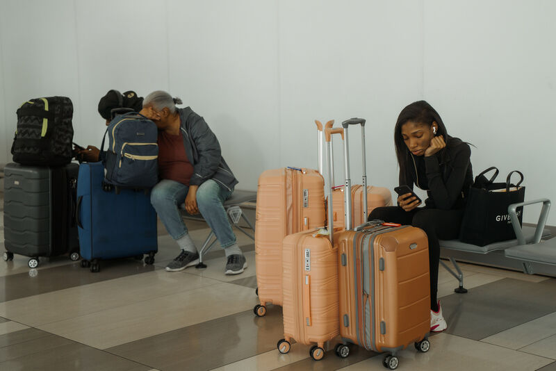 Travelers wait at LaGuardia International Airport on Saturday, Nov. 8, 2025, in New York. (AP Photo/Olga Fedorova)