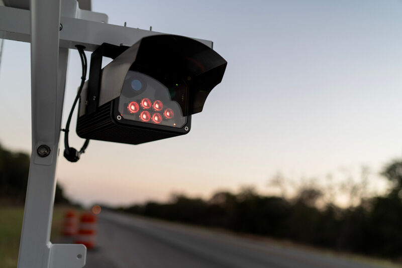 A license plate reader stands along the side of a road, Wednesday, Oct. 15, 2025, in Stockdale, Texas. (AP Photo/David Goldman)