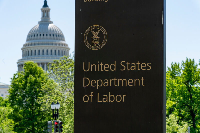 FILE - In this May 7, 2020, file photo, the entrance to the Labor Department is seen near the Capitol in Washington. (AP Photo/J. Scott Applewhite, File)