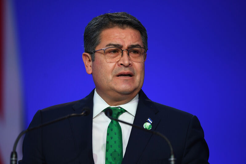 FILE - Honduras' President Juan Orlando Hernandez speaks during the opening ceremony of the UN Climate Change Conference COP26 in Glasgow, Scotland, Monday Nov. 1, 2021. Andy Buchanan/Pool via AP, File)