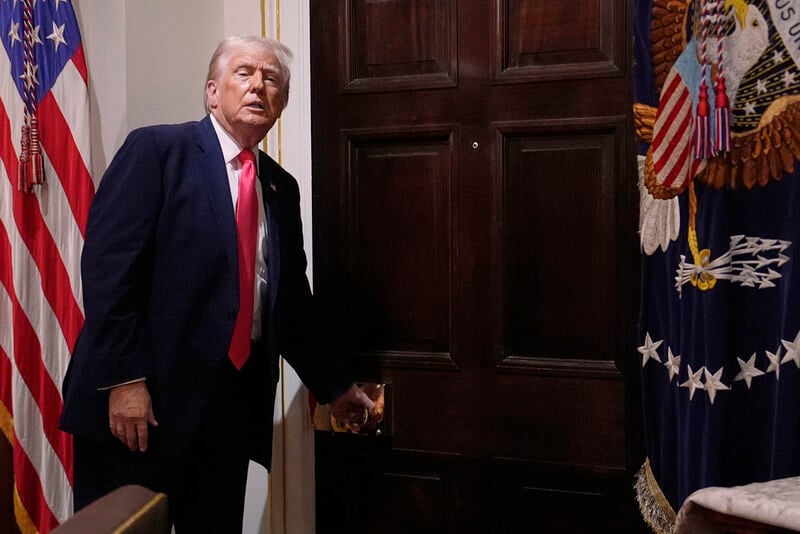 President Donald Trump walks out of the Cabinet Room following a Cabinet meeting at the White House, Tuesday, Dec. 2, 2025, in Washington. (AP Photo/Julia Demaree Nikhinson)