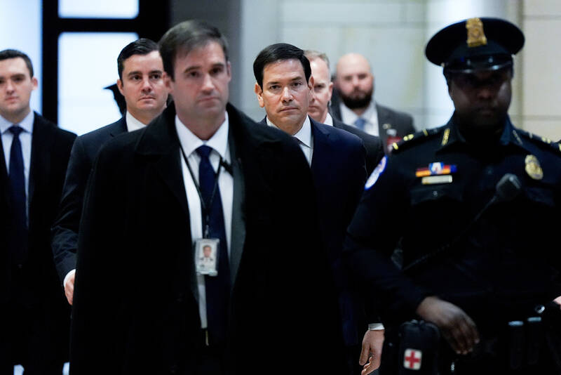 Secretary of State Marco Rubio arrives to brief members of Congress on military strikes near Venezuela, Tuesday, Dec. 16, 2025, at the Capitol in Washington. (AP Photo/Julia Demaree Nikhinson)