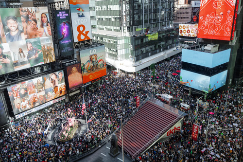 Thousands of protesters fill Times Square during a "No Kings" protest Saturday, Oct. 18, 2025, in New York. (AP Photo/Olga Fedorova)