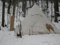 white canvass tent, snow, hunting gear