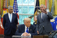 President Donald Trump listens as Health and Human Services Secretary Robert F. Kennedy Jr., speaks as he signs executive orders and proclamations in the Oval Office of the White House, Monday, May 5, 2025, in Washington. Jay Bhattacharya, director of the National Institutes of Health, listens at left. (AP Photo/Alex Brandon)