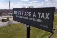 FILE - A digital bill board flashes a tariffs message in Kennedy Township, Pa., Tuesday, March 25, 2025. (AP Photo/Gene J. Puskar, file)