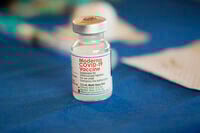 FILE - A vial of Moderna COVID-19 vaccine rests on a table at an inoculation station in Jackson, Miss., on July 19, 2022. (AP Photo/Rogelio V. Solis, File)