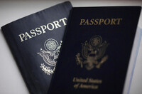 FILE - U.S. passports are arranged for a photograph in Tigard, Ore., on Dec. 11, 2021. (AP Photo/Jenny Kane, File)
