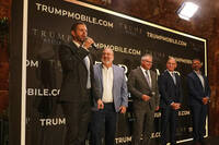 Eric Trump, Don Hendrickson, Eric Thomas, Patrick O'Brien and Donald Trump Jr., left to right, participate in the announcement of Trump Mobile, in New York's Trump Tower, Monday, June 16, 2025. (AP Photo/Richard Drew)