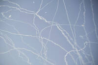 FILE - Israeli air defense system fires to intercept missiles during an Iranian attack over Tel Aviv, Israel, Thursday, June 19, 2025. (AP Photo/Leo Correa, File)