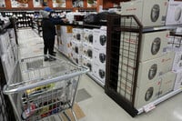 FILE - Shoppers shop electric rice cookers imported from Japan and Korea at the H Mart in Niles, Ill., April 3, 2025. (AP Photo/Nam Y. Huh, File)