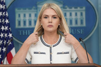 White House press secretary Karoline Leavitt adjusts her hair as she speaks with reporters in the James Brady Press Briefing Room at the White House, Thursday, July 17, 2025, in Washington. (AP Photo/Alex Brandon)