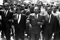 FILE - The Rev. Ralph Abernathy, right, and Bishop Julian Smith, left, flank Dr. Martin Luther King, Jr., during a civil rights march in Memphis, Tenn., March 28, 1968. (AP Photo/Jack Thornell, File)
