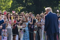 President Donald Trump speaks with supporters before departing on Marine One from the South Lawn of the White House, Friday, July 25, 2025, in Washington. The President is traveling to Scotland. (AP Photo/Alex Brandon)