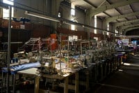 Sewing machines are lined up inside the empty Tzicc clothing factory following the threat of U.S.-imposed tariffs in Maseru, Lesotho, Tuesday, July 22, 2025. (AP Photo/Bram Janssen)