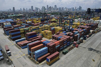 Stacks of containers are seen at the Manila North Harbour Port in Manila, Philippines, Thursday, Aug. 7, 2025. (AP Photo/Aaron Favila)