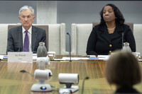 FILE - Federal Reserve Chairman Jerome Powell, and Board of Governors member Lisa Cook, right, listen during an open meeting of the Board of Governors at the Federal Reserve, June 25, 2025, in Washington. (AP Photo/Mark Schiefelbein, File)