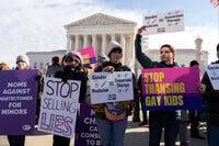 FILE - Demonstrators against transgenders rights protest during a rally outside of the Supreme Court, Dec. 4, 2024, in Washington. (AP Photo/Jose Luis Magana, File)