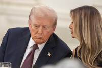 President Donald Trump listens as first lady Melania Trump repeats a question for him during a dinner in the State Dinning Room of the White House, Thursday, Sept. 4, 2025, in Washington. (AP Photo/Alex Brandon)