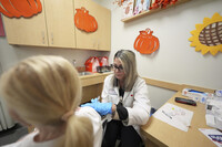 Pharmacy manager Aylen Amestoy administers a patient with a COVID-19 vaccine at a CVS Pharmacy in Miami, Tuesday, Sept. 9, 2025. (AP Photo/Rebecca Blackwell)