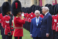 President Donald Trump and Britain's King Charles III review the Guard of Honour after the arrival at Windsor Castle in Windsor, England, Wednesday, Sept. 17, 2025.(AP Photo/Kirsty Wigglesworth, Pool)