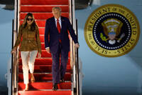 President Donald Trump and first lady Melania Trump disembark Air Force One at Joint Base Andrews, Md., Thursday, Sept. 18, 2025, after returning from a state visit to Britain. (AP Photo/Luis M. Alvarez)