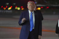 President Donald Trump gestures as he arrives on Air Force One at John F. Kennedy International Airport, Monday, Sept. 22, 2025, in New York. (AP Photo/Evan Vucci)