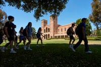 FILE - Students walk past Royce Hall at the UCLA campus in Los Angeles, Aug. 15, 2024. (AP Photo/Damian Dovarganes, File)