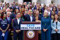 House Minority Leader Hakeem Jeffries, D-N.Y., center, flanked by Rep. Pete Aguilar, D-Calif., left, and Rep. Katherine Clark, D-Mass., arrives to speak on the steps of the Capitol to insist that Republicans include an extension of expiring health care benefits as part of a government funding compromise, in Washington, Tuesday, Sept. 30, 2025. (AP Photo/J. Scott Applewhite)