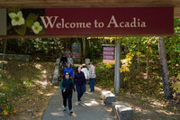 Visitors walk back to the parking lot after discovering the visitor center, park store and restrooms are closed at Acadia National Park, Wednesday, Oct. 1, 2025, in Maine. (AP Photo/Robert F. Bukaty)