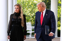 President Donald Trump, with Erika Kirk, walks out to present the Presidential Medal of Freedom for Charlie Kirk to his widow Erika Kirk, in the Rose Garden of the White House, Tuesday, Oct. 14, 2025, in Washington. (AP Photo/Mark Schiefelbein)