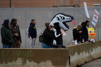 Several protesters stand outside the U.S. Immigration and Customs Enforcement building Wednesday, Oct. 15, 2025, in Broadview, Ill. (AP Photo/Erin Hooley)