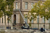 A basket lift used by thieves is seen at the Louvre museum Sunday Oct.19, 2025 in Paris. (AP Photo/Alexander Turnbull)