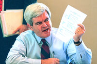 FILE - House Speaker Newt Gingrich holds a sheet of budget figures on Capitol Hill, Nov. 15, 1995, during a meeting to discuss the federal budget impasse. (AP Photo/Joe Marquette, File)