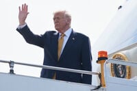 President Donald Trump waves as he boards Air Force One at Kuala Lumpur International Airport in Sepang, Malaysia, as he departs for Japan, Monday, Oct. 27, 2025. (AP Photo/Mark Schiefelbein)