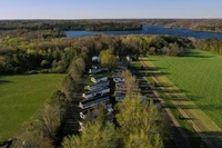 Evening sunlight shines on manufactured homes at Countryside Park Cooperative on May 7, 2025, in Cumberland, Wis. (Joe Timmerman / Wisconsin Watch)