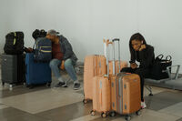 Travelers wait at LaGuardia International Airport on Saturday, Nov. 8, 2025, in New York. (AP Photo/Olga Fedorova)