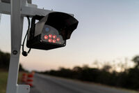 A license plate reader stands along the side of a road, Wednesday, Oct. 15, 2025, in Stockdale, Texas. (AP Photo/David Goldman)