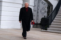 President Donald Trump walks towards reporters from the South Lawn of the White House, Saturday, Nov. 22, 2025, in Washington, en route to Joint Base Andrews. (AP Photo/Jose Luis Magana)