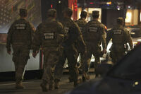Nation Guard move through the area following the shooting of two National Guard soldiers near the White House Wednesday, Nov. 26, 2025, in Washington. (AP Photo/Mark Schiefelbein)