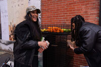 Kashish Ali and Elliott McKnight stock a One Love Community Fridge with food, Nov. 15, 2025, in Brooklyn, New York. (AP Photo/Adam Gray)