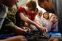 Students work together on a science, technology, engineering and mathematics challenge, facilitated by the Kentucky Science Center, in Simpsonville Elementary School, Nov. 18, 2025, in Simpsonville, Ky. (AP Photo/Jon Cherry)