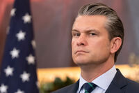 Defense Secretary Pete Hegseth listens during an event at the State Department, Monday, Dec. 8, 2025, in Washington. (AP Photo/Mark Schiefelbein)