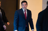 Secretary of State Marco Rubio walks to a secure room in the basement of the Capitol to brief senators on military strikes near Venezuela, Tuesday, Dec. 16, 2025, in Washington. (AP Photo/Jose Luis Magana)
